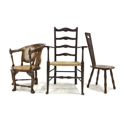 Early 20th century walnut corner armchair, with cane seat and back panels and raised on three cabriole supports and a turned rear support united by stretchers, (W64cm) together with an early 20th century ladderback armchair with string seat (W63cm) and a walnut spinning chair, with floral carved back and seat panels raised on turned supports, (W33cm)