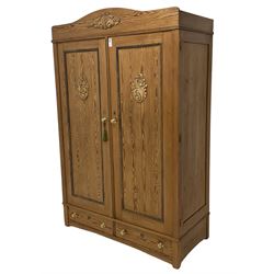 Late 19th century pitch pine double wardrobe, enclosed by two panelled doors, two drawers to base 