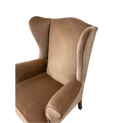 Parker Knoll - wingback armchair upholstered in light pink fabric, raised on cabriole supports
