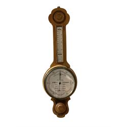 The Wilson Forecast Barometer - 20th century oak cased aneroid barometer with a white dial reading atmospheric pressure from 26 to 31 inches, with forecast predictions, steel indicating hand and brass recording hand, with a flat glass and brass bezel, boxed mercury thermometer with Celsius and Fahrenheit graduations. 