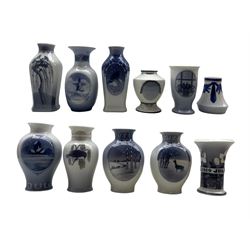 Nine Royal Copenhagen Christmas vases dated 1917, 1919, 1920, 1921, 1922, 1923, 1924, 1926 and 1930, together with two Royal Copenhagen Easter vases dated 1918 and 1921 (11)
