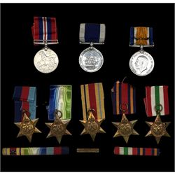 Group of seven WWII medals comprising 1939-45 Star, Atlantic Star, Africa Star with 1942-43 bar, Burma Star, Italy Star, Defence medal and War medal with presentation leaflet, together with Edward VII Royal Navy Long Service and Good Conduct medal to William Swain, Commissioned Boatswain, H.M. Coastguard