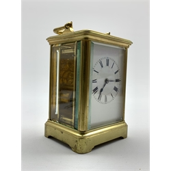  Early 20th century brass four glass carriage time piece, white enamel dial with Roman numeral chapter ring,  movement stamped 'H J, Made in Paris' H14cm  