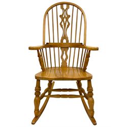 Beech rocking Windsor armchair, double bow back and stick back with pierced and shaped splat, dished seat, on turned supports with double H-stretcher, on rockers