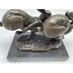 Bronze figure group, modelled as two hares in chase, signed Nick and with foundry mark, upon a rectangular base, overall H12cm L16cm