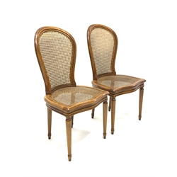 Pair French style bergère chairs, moulded beech frames, curved cane work backs and serpentine seats, turned supports