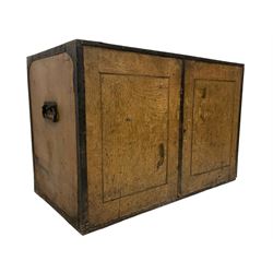 19th century scumbled pine sea chest or cupboard, bound with wrought iron fittings and twin handles, two cupboard doors enclosing single shelf