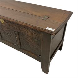 18th century oak coffer or chest, rectangular double hinged top with moulded edge, lunette carved frieze over triple panelled front with foliate and lozenge carvings, on stile feet