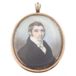 English School (Circa 1800)
Portrait miniature upon ivory
Head and shoulder portrait of a gentleman wearing a black coat and white cravat tied in a bow
Within period gold frame with hair work panel with seed pearl monogram 'JW' verso
Oval 7cm x 5.5cm