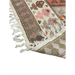 Kilim rug, in pale shades with overall geometric design 
