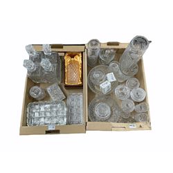 Five cut glass decanters, one boxed, pressed glass rectangular trays, Bohemian cut glass vases, fruit bowls, two Balmoral crystal figures in boxes and other glass in two boxes (qty)