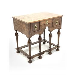 17th century style oak lowboy, rectangular top with moulded edge over three drawers and shaped apron, raised on turned supports united by shaped stretcher 73cm x 48cm, H68cm