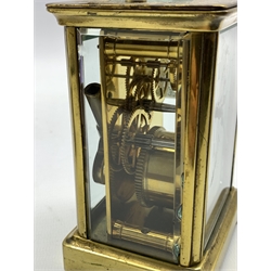 Early 20th century brass and glass carriage timepiece, with white enamel dial and 30 hour movement, (H11cm) together with two aneroid barometers in brass cases
