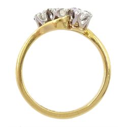 18ct gold three stone round brilliant cut diamond crossover ring, stamped, total diamond weight approx 0.75 carat