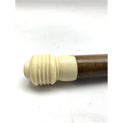 20th century hardwood walking cane, the earlier turned ivory handle unscrews to reveal baby's rattle modelled as Peter Rabbit, unmarked, L91cm