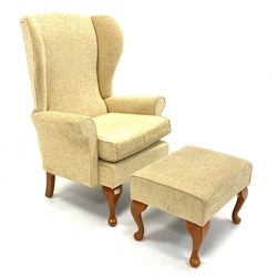  Wing back upholstered armchair with stool, W74cm