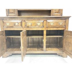 18th century style pollard oak dresser, the three height plate rack with projecting cornice over shaped apron, two open shelves and two spice cupboards, three drawers and three cupboards to base, raised on bracket supports W140cm