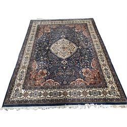 Persian blue ground rug, ivory medallion on blue field decorated with interlaced foliate, 365cm x 278cm