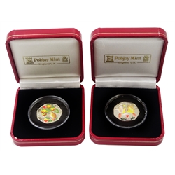 Queen Elizabeth II 2005 and 2006 Isle of Man coloured silver proof Christmas fifty pence coins, both cased with certificates