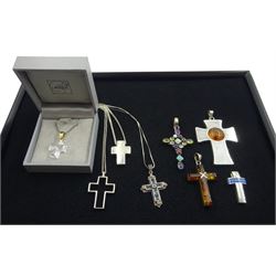 Lalique glass cross pendant, two silver amber cross pendants and five other silver and stone set silver cross pendants, with three silver chains, stamped or tested (8)
