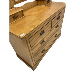 Edwardian pine dressing chest, the swing mirror over two trinket drawers, two short and two long drawers under, raised on stile supports W106cm