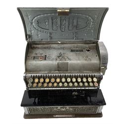 Early 20th century National Cash Register by the National Cash Register Co., Dayton, Ohio, USA, of typical form with nickel-plated ornate cast brass body, hinged cover, oak stand base, Size Number 36 1/4 - SH, Factory Number V-51156, Sold by The National Cash Registers Co. Ltd. 225 & 226 Tottenham Court Rd, London, Rd. No. 426948, H43cm, W45cm, D41cm. Provenance: Property of the late Kenneth Soper, (1920-1970) prominent local businessman and collector. Then by descent through Sopers of Doncaster, well known family business. The register was in active use by the business from the 1960s to the 2020s.