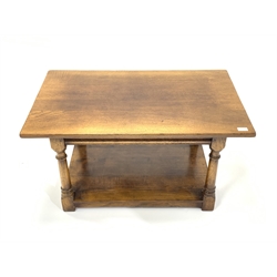 Titchmarsh and Goodwin style honey oak coffee table, raised on turned and block supports united by under tier. 