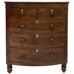 Victorian mahogany bow front chest, fitted with two short and three long drawer, raised on turned feet, with bone shield shaped escutcheons  