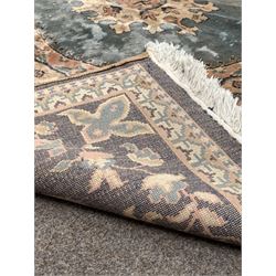 Persian design beige ground rug, with stylised floral design and bordered 289cm x 183cm