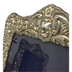 Pair of silver photograph frames with floral embossed decoration aperture size 25cm x 20cm Sheffield 2004 Maker Carr & Co