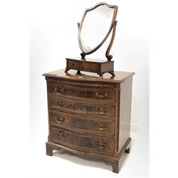 Georgian style serpentine front chest, brushing slide over four graduated drawers, canted and fluted front corners, raised on bracket supports, (W71cm, D46cm, H78cm) together with a mahogany swing mirror fitted with two trinket drawers (W46cm)