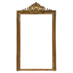 19th century giltwood and gesso wall mirror, ornate pediment decorated with central shell motif surrounded by foliate and flower heads, gadroon moulded frame with beaded slip, plain mirror plate 