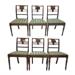 Set of six Regency mahogany dining chairs, turned crest rail over pierced and moulded rail back with ebonised string inlay, drop in upholstered seat pads upholstered in striped green silk, raised on ring turned front supports 