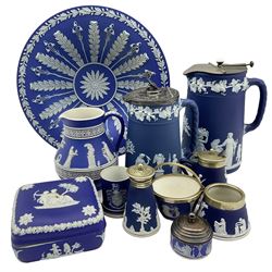 Group of Wedgwood dark blue jasper ware dip items comprising fruit dish D26cm, two hot water jugs with metal covers, various small condiments etc, jug and a box and cover (11)