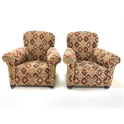 Early 20th century two seat sofa, upholstered in kilim type fabric raised on turned front supports with recessed castors (W142cm, H83cm, D93cm) together with a pair of matching armchairs, (W90cm)