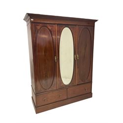 Warings - Edwardian mahogany wardrobe, the pjecting cornice over one central mirror door, flanked by two cupboards, over two drawers, raised on a plinth base, together with a dressing chest with swing mirror, raised on square tapering supports, terminating in brass castors