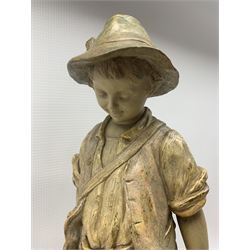 Otto Petri (German 1860-1942): For Goldscheider painted terracotta centrepiece with large glass bowl, modelled as boy with dog, mounted on rock formation, signed 'Petri' impressed with factory mark H62cm