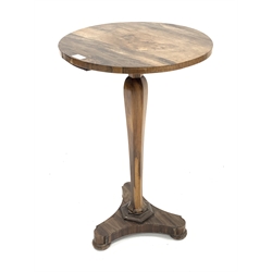 Mid 19th century rosewood lamp table, the circular top raised on a shaped and tapered octagonal column and a trefoil base 