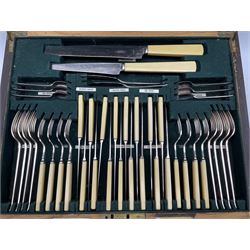 Art Deco canteen of Regent Plate cutlery for eight settings retailed by Goldsmtihs & Silversmiths, in stained oak case with simulated ivory handle, L46.5cm 