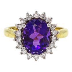 18ct gold oval amethyst and round brilliant cut diamond cluster ring, hallmarked