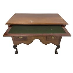 Georgian style mahogany low boy, the rectangular top with moulded edge, fitted with brushing slide with inset baize surface with reeded front, central frieze drawer over two short drawers, each cockbeaded and with crossbanding and brass handle pulls, the shaped apron raised on cabriole supports carved with acanthus leaves, terminating in ball and claw feet