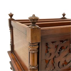 Victorian mahogany three-division Canterbury,  turned supports and finials, panelled sides and fretwork panelled front, cavetto moulded frieze with single drawer, turned feet on castors