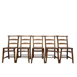 Set ten chapel chairs, the shaped elm seat raised on turned supports, united by stretchers