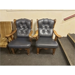 Two Chairs with Blue Leather Cushioning