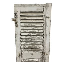 Pair of 19th century French wooden shutters, in distressed white painted finish, with scrolled wrought iron hinges