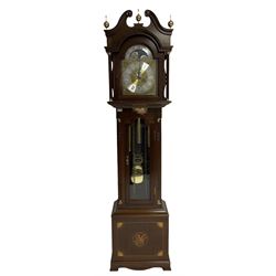 A mahogany effect longcase clock made to celebrate the millennium in the year 2000, this clock being No 2 of only 200 manufactured by  Richard Broad in Bodmin Cornwall, with a traditional swans neck pediment with three brass finials, break arch hood door on a trunk with recessed columns and full length glazed door, on a square plinth with inlay and a shaped base, brass dial with brass spandrels, silvered chapter ring, seconds dial and working moon phase to the arch, weight driven three train movement striking the quarters and hours on 12 gong rods, with a choice of St Michael, Westminster and Wittington chimes, with chime selector and chime/silent facility. With three brass cased weights and gridiron pendulum.

