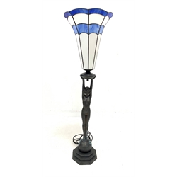 Tiffany style figural uplighter standard lamp, trumpet form shade on octagonal stepped base, H110cm