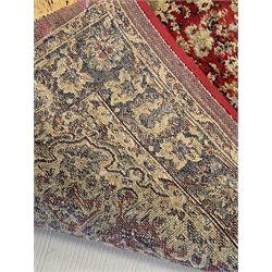  Persian design red ground runner rug, with three medallions on red field, 78cm x 310cm  