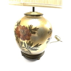 A near pair of glass table lamps having floral decoration on lustre ground, with pleated shades, H66cm max