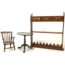 20th century walnut wall hanging shelf fitted with three drawers and two open shelves together with a Chippendale design occasional table, the oval top with moulded edge over a spiral turned and fluted column and leaf caved triple splay supports with paw feet (W61cm) and a small child's commode chair (W33cm)